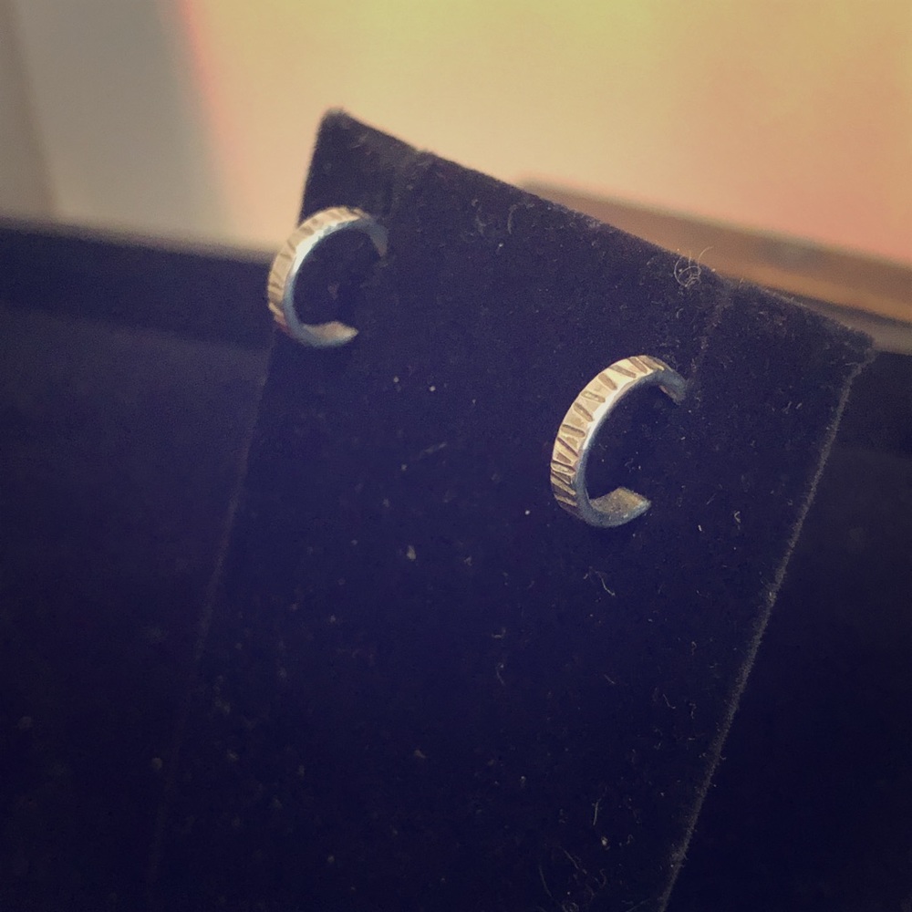 4/$16 Base metal silver half hoop earrings